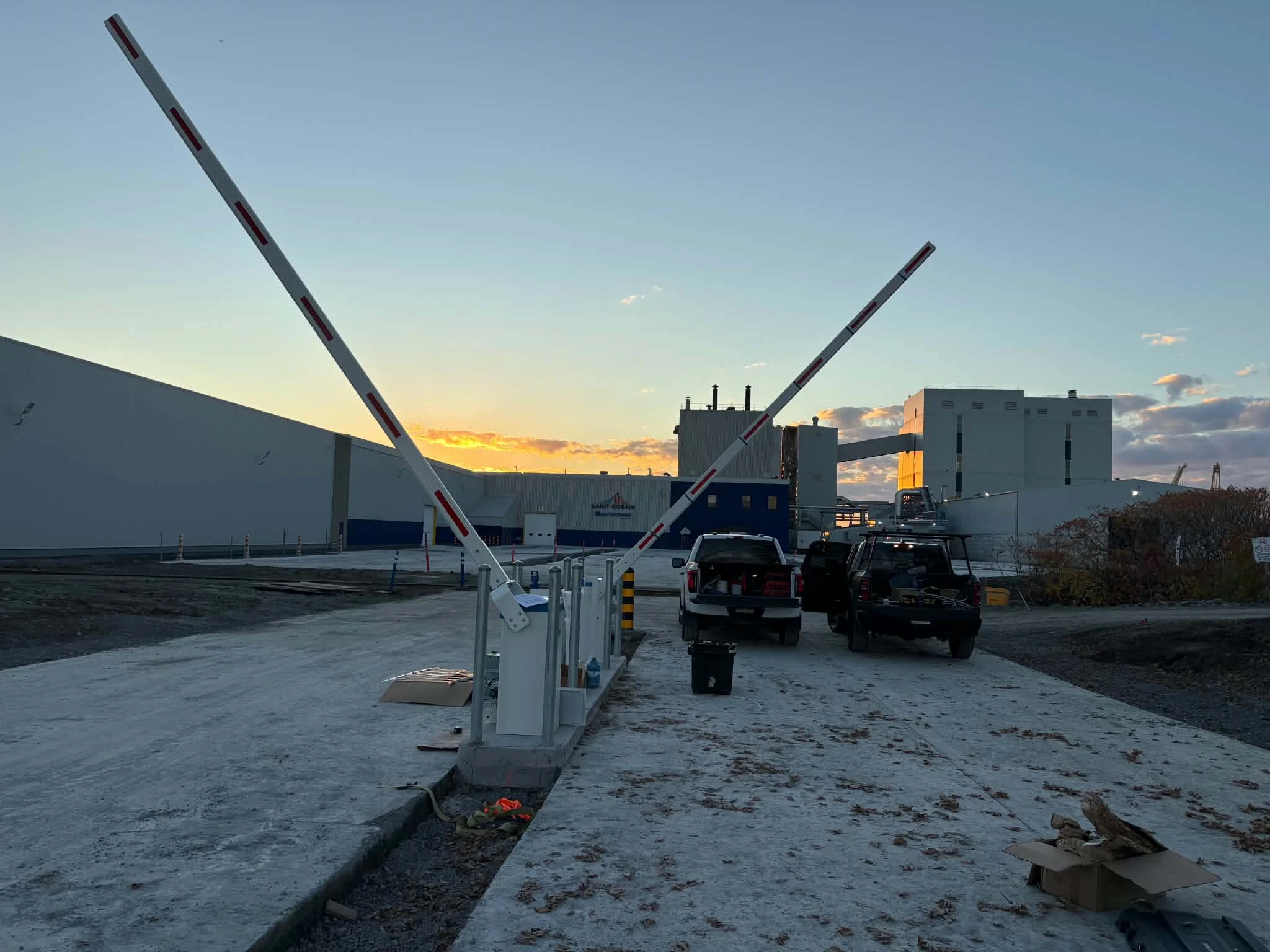 Raised barrier arms and control enclosures at CertainTeed’s facility in Sainte-Catherine.